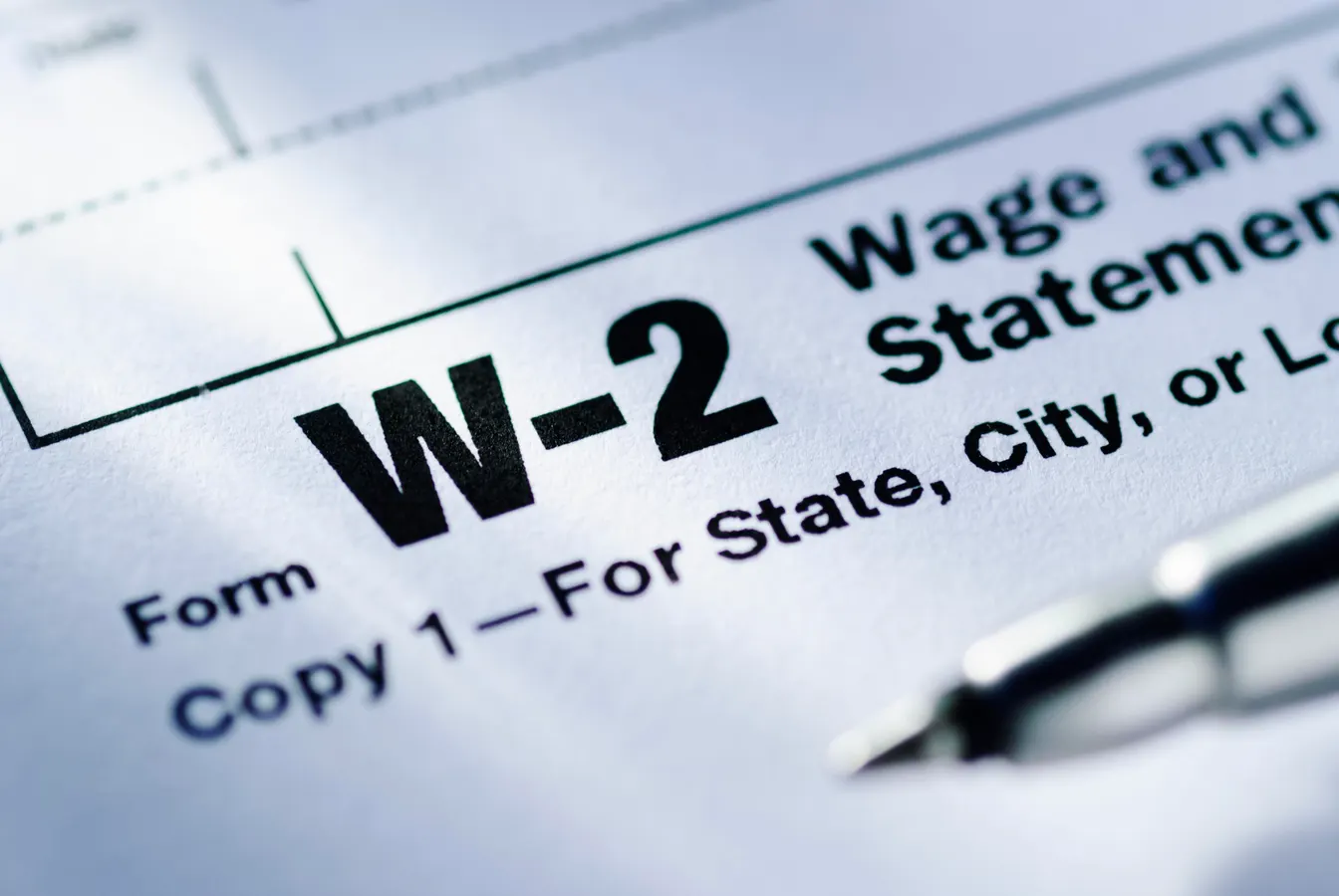 Employee reviewing IRS Form W-2 wage and tax statement